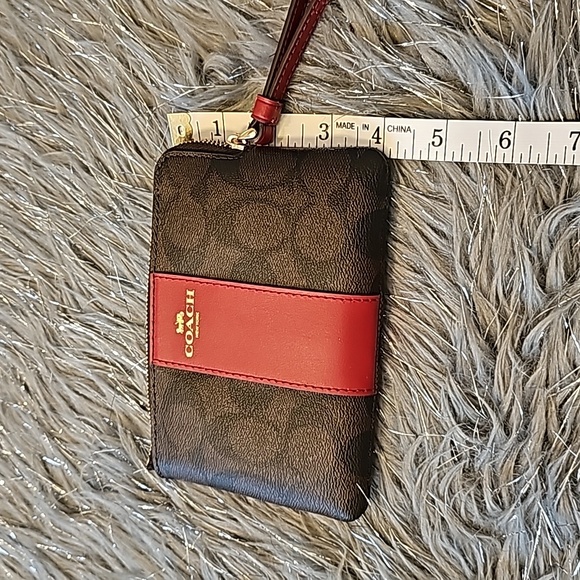 Coach Signature canvas corzip wristlet in gold/walnut/bold red. - Picture 4 of 5